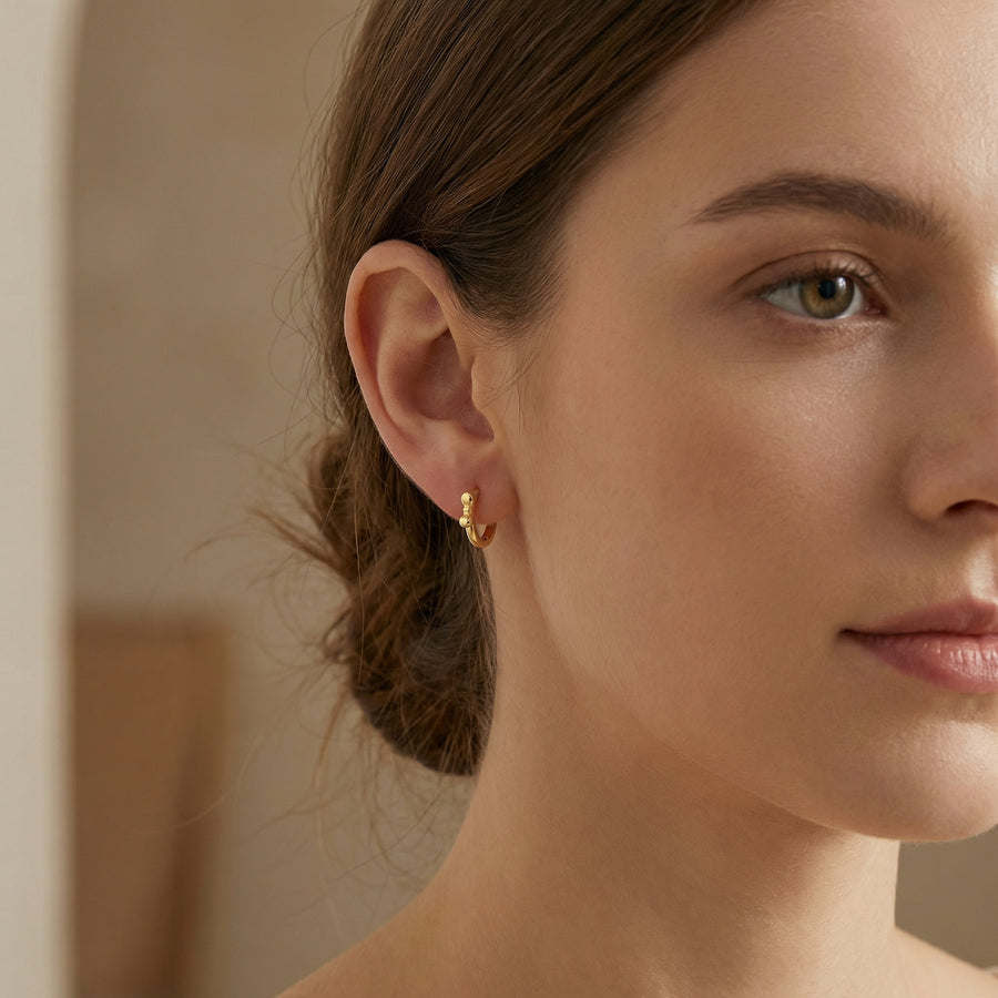 Bowknot Huggie Hoop Earrings – sterling silver earrings, front view