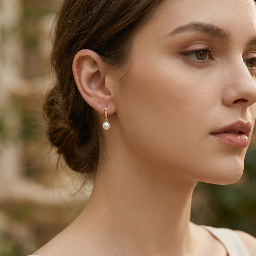 Wavy Huggie Hoops with Pearl Drops – pearl earrings, close-up