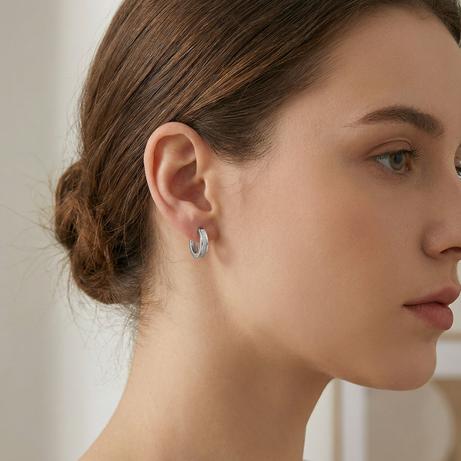 Textured Huggie Hoops, Polished Borders – sterling silver earrings, front view