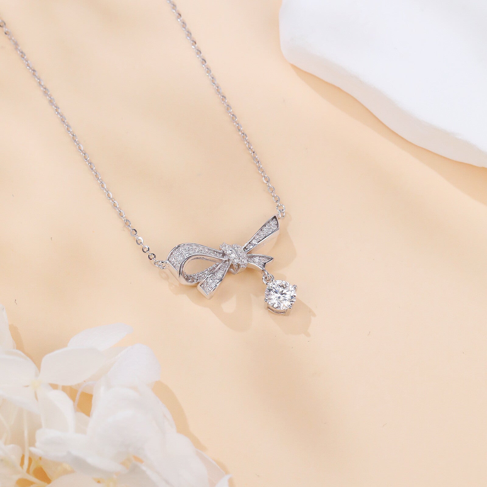 Silver Bow Necklace with Sparkling stone Charm – sparkling stone necklace, styling detail