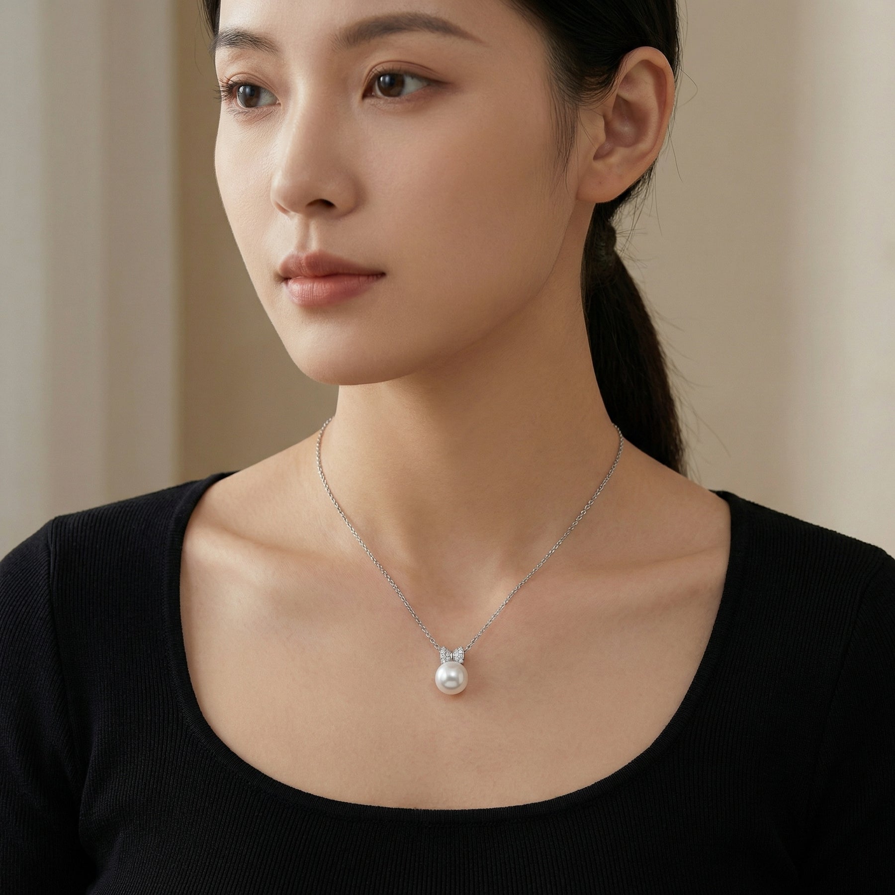 Pearl Pendant Necklace with Bow Bail – pearl necklace, close-up