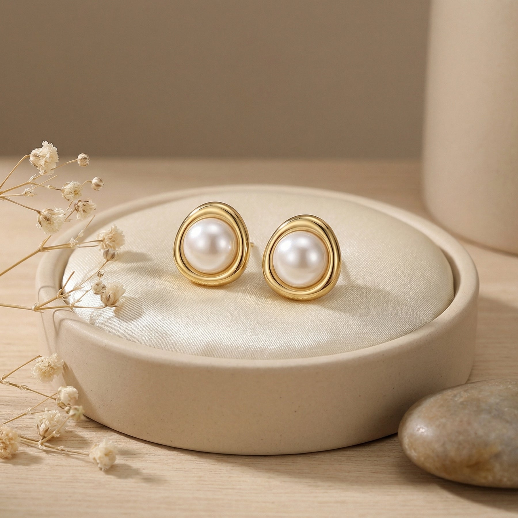 Pearl Studs in Sculptural Gilded Setting – pearl earrings, close-up