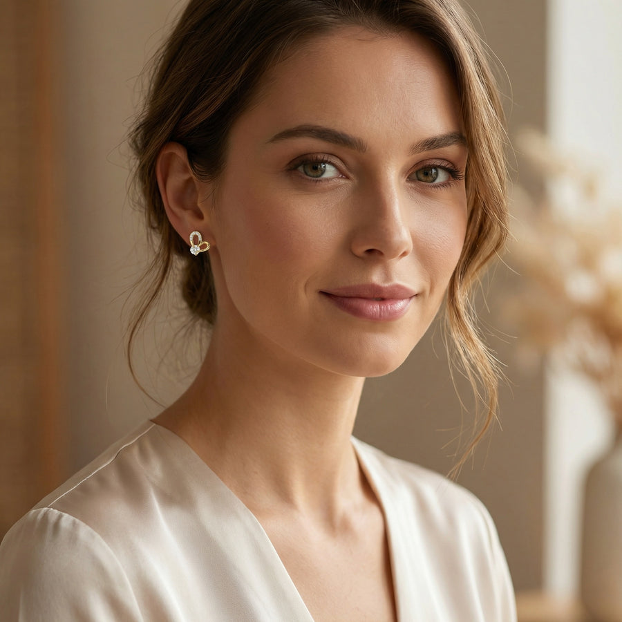 Heart-Shaped Clear Gemstone Studs – sterling silver earrings, front view