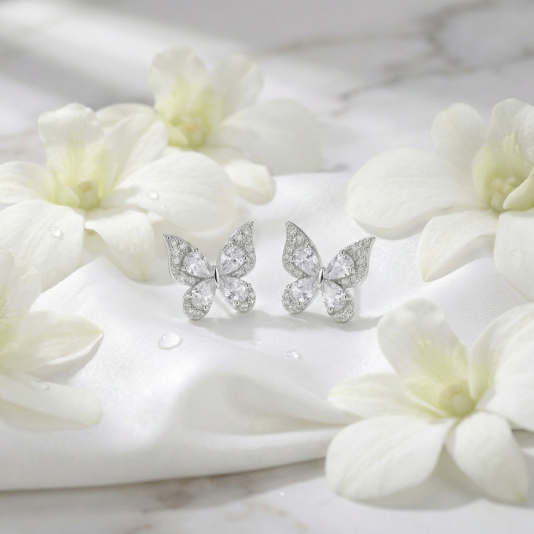 Butterfly Studs with Sparkling Pear Cuts – sterling silver earrings, front view