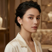 Scalloped Pearl Studs, Baguette Halo – pearl earrings, close-up
