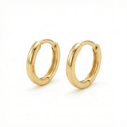 Polished Minimalist Huggie Hoops – sterling silver earrings, close-up