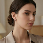 Silver Swirl Pearl Huggie Hoops – pearl earrings, side detail