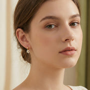 Floral Charm Huggie Hoop Earrings – sterling silver earrings, styling detail