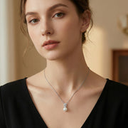 Horseshoe Pearl Necklace – pearl necklace, close-up