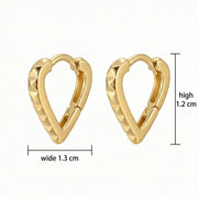 Pyramid Studded Heart Huggie Hoops – sterling silver earrings, close-up