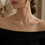 Dual Drop Necklace, Pearl and Charm – pearl necklace, close-up