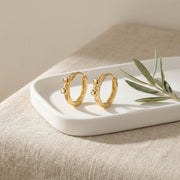 Bowknot Huggie Hoop Earrings – sterling silver earrings, close-up