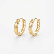 Textured Geometric Huggie Hoops – sterling silver earrings, close-up