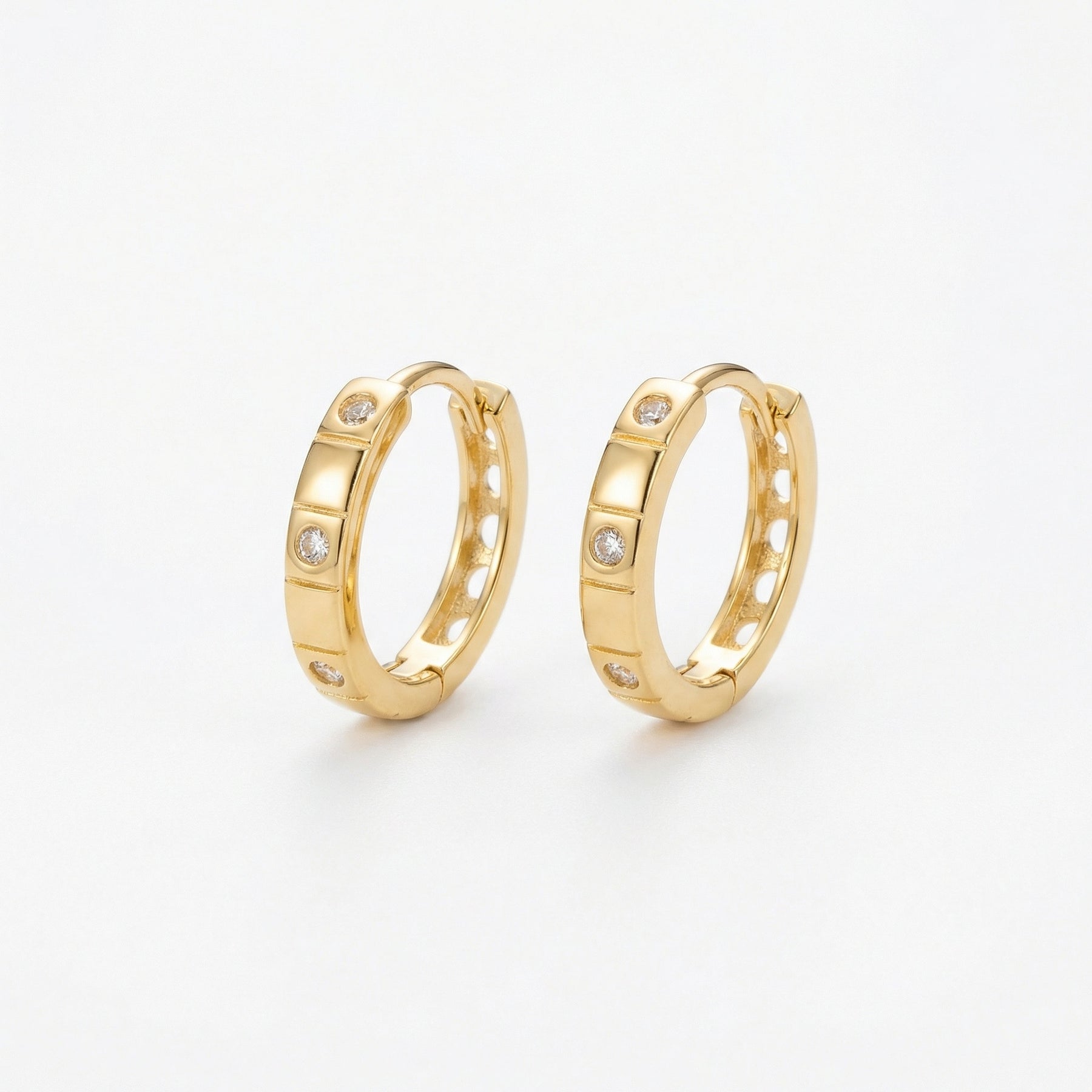 Textured Geometric Huggie Hoops – sterling silver earrings, close-up