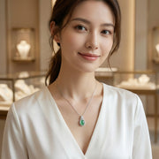 Oval Jadeite Pendant with Floral Bail – jade necklace, close-up