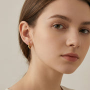 Wavy Organic Huggie Earrings – sterling silver earrings, close-up
