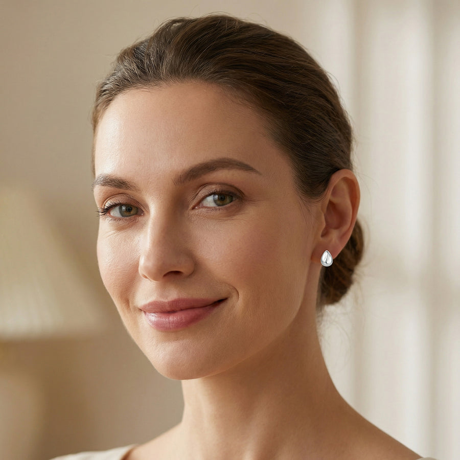Teardrop Studs with Sculptural Wave – sterling silver earrings, front view