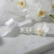 Four-Petal Flower Pearl Studs – pearl earrings, front view