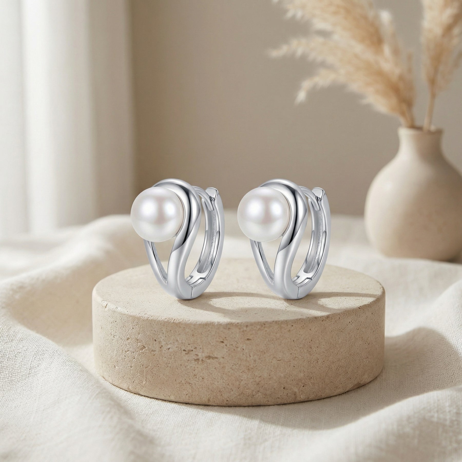 Silver Swirl Pearl Huggie Hoops – pearl earrings, close-up