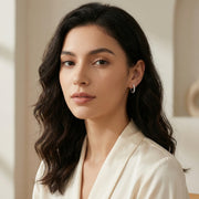 Wavy Scalloped Huggie Hoop Earrings – sterling silver earrings, close-up