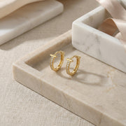 T-Shaped Pavé Huggie Hoop Earrings – sterling silver earrings, front view