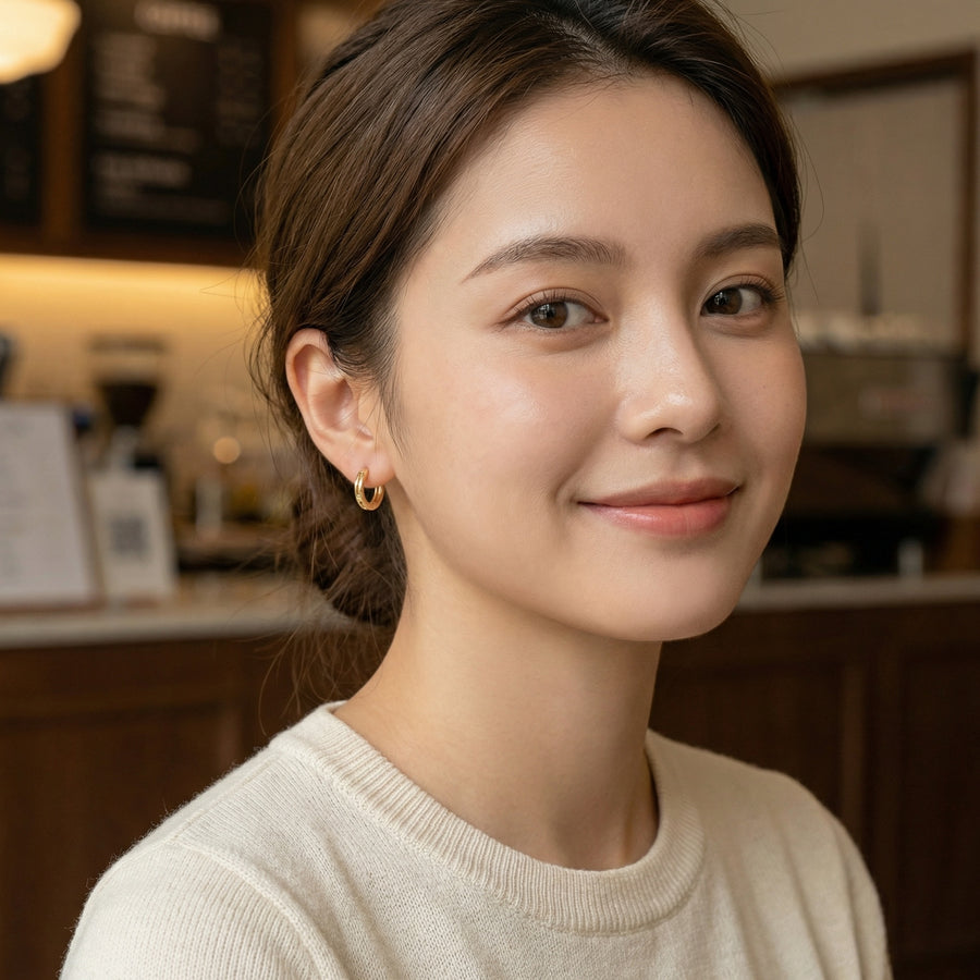 Geometric Cutout Huggie Earrings – sterling silver earrings, front view