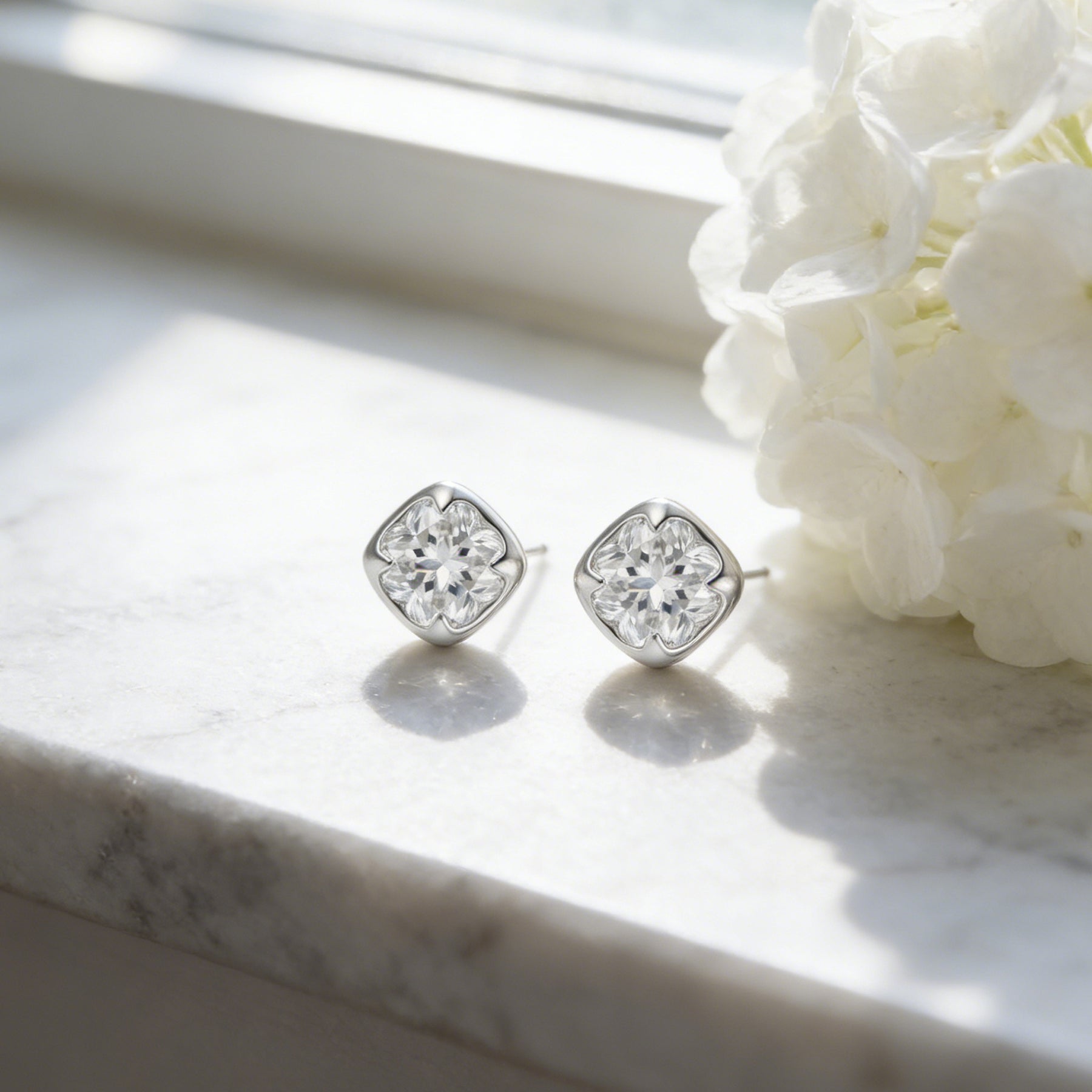 Cushion-Cut CZ Studs with Clover Inset – zircon earrings, front view