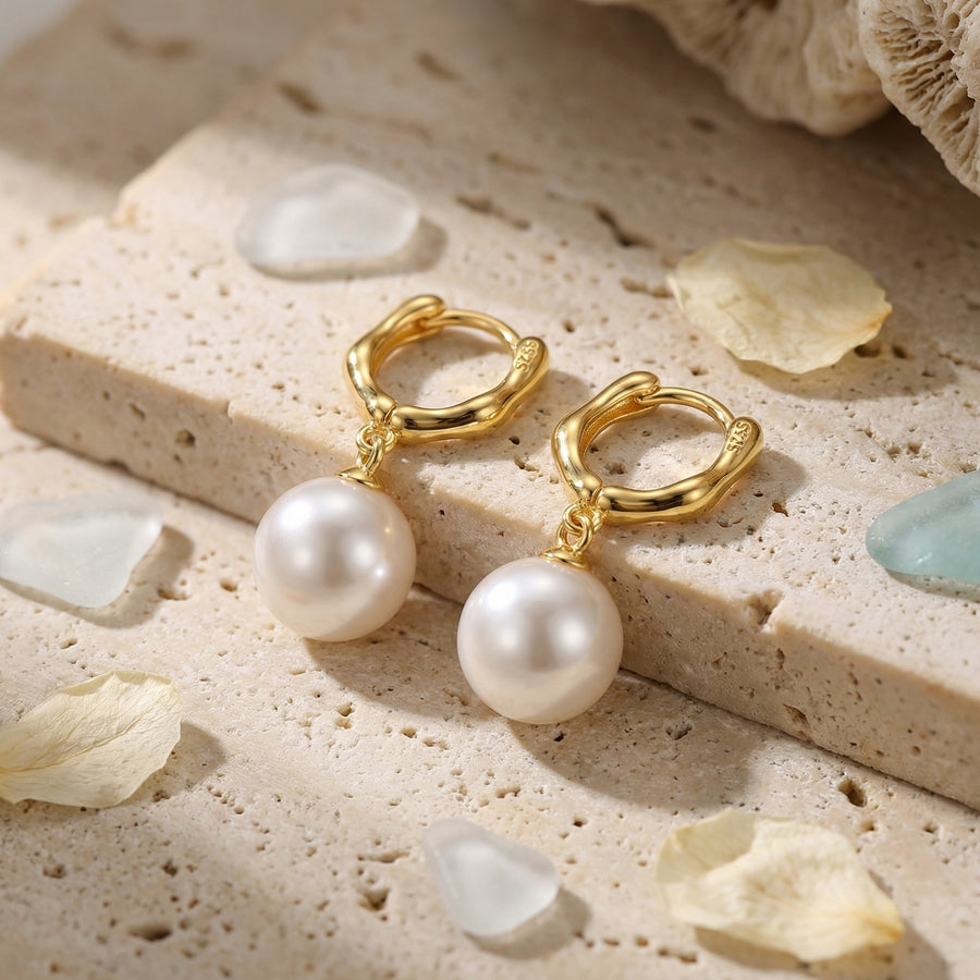 Wavy Huggie Hoops with Pearl Drops – pearl earrings, front view