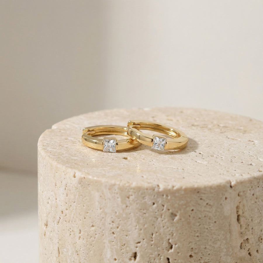 Princess-Cut Huggie Hoop Earrings – sterling silver earrings, front view