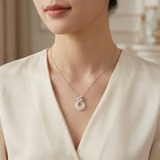 White Jade Donut Necklace with Pink Flower – jade necklace, close-up