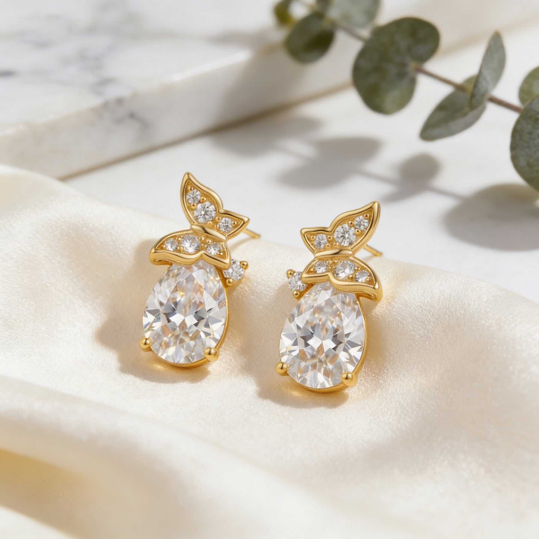 Pear-Shaped CZ Studs with Floral Accents – zircon earrings, front view