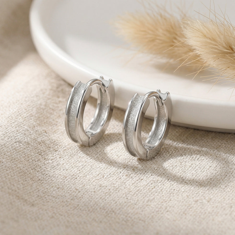 Textured Huggie Hoops, Polished Borders – sterling silver earrings, side detail