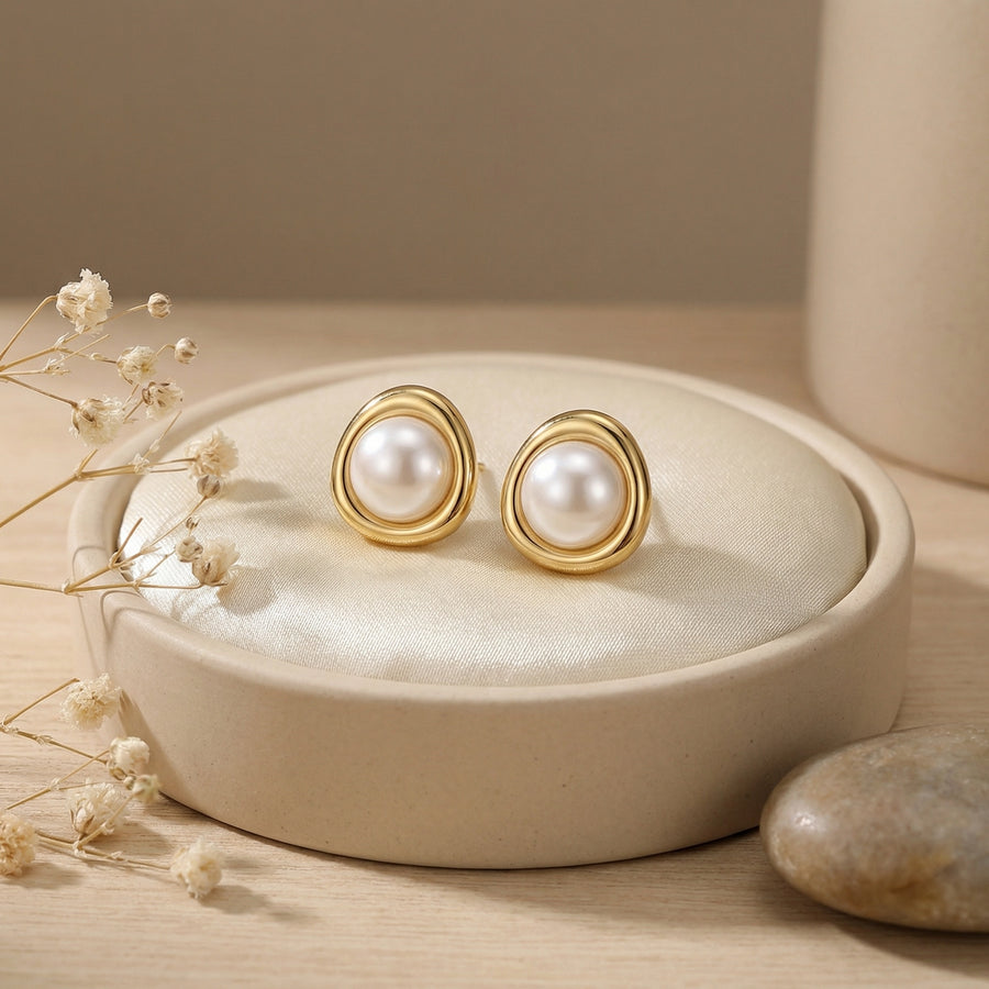 Pearl Studs in Sculptural Gilded Setting – pearl earrings, close-up