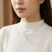 Violin Scroll Pearl Necklace – pearl necklace, close-up