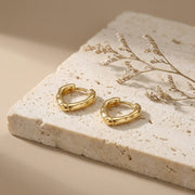 Molten Texture Huggie Hoop Earrings – sterling silver earrings, close-up