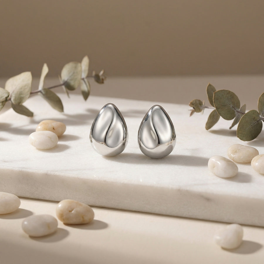 Teardrop Studs with Sculptural Wave – sterling silver earrings, close-up