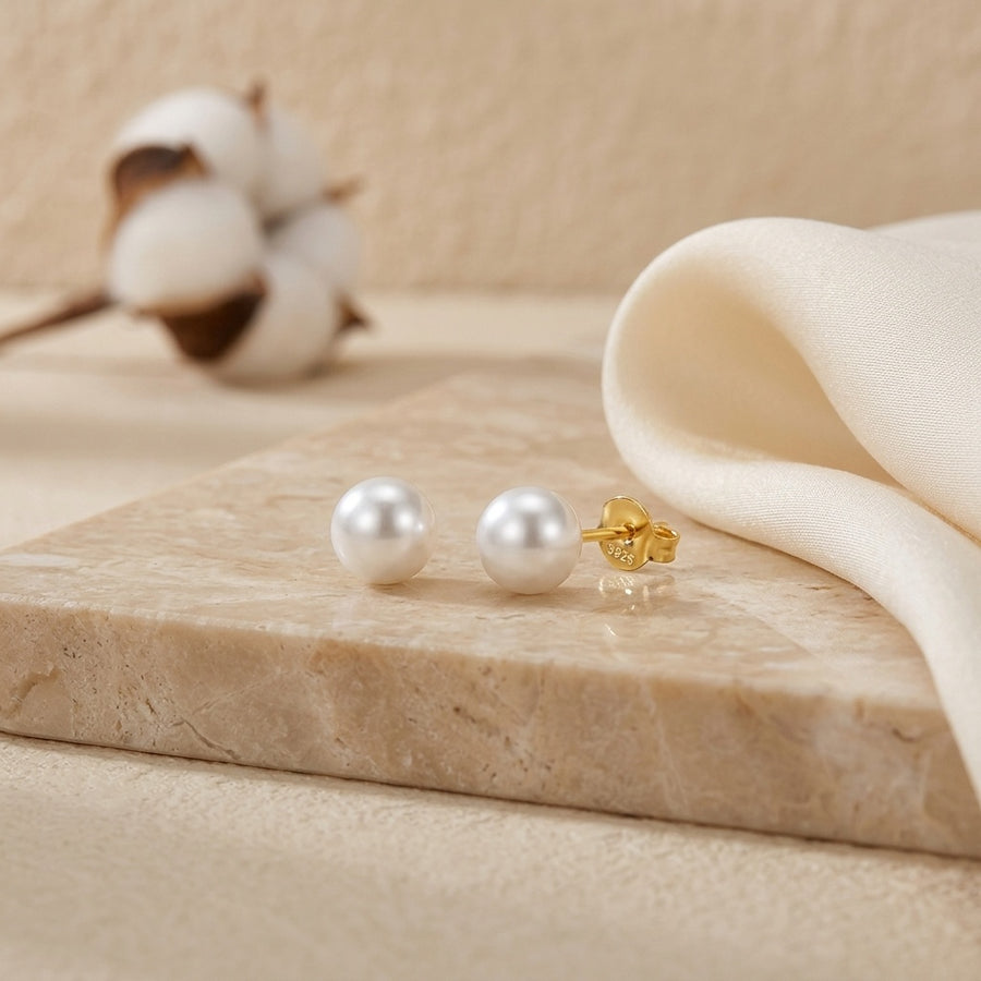 Pearl Studs with Gilded Backings – pearl earrings, front view