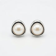 Pearl Studs in Triangular Settings – pearl earrings, close-up