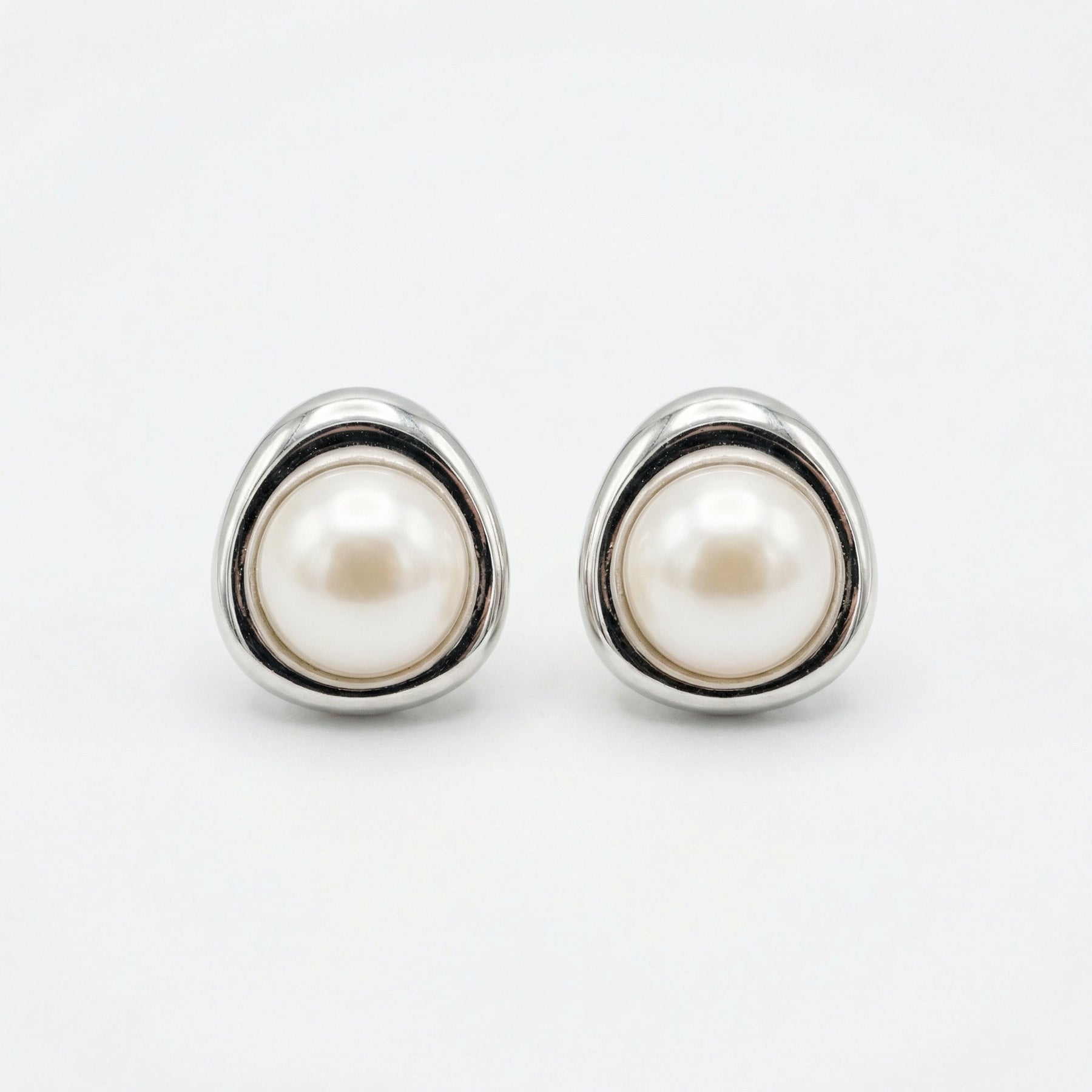 Pearl Studs in Triangular Settings – pearl earrings, close-up