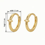 Polished Cross Huggie Hoop Earrings – sterling silver earrings, close-up